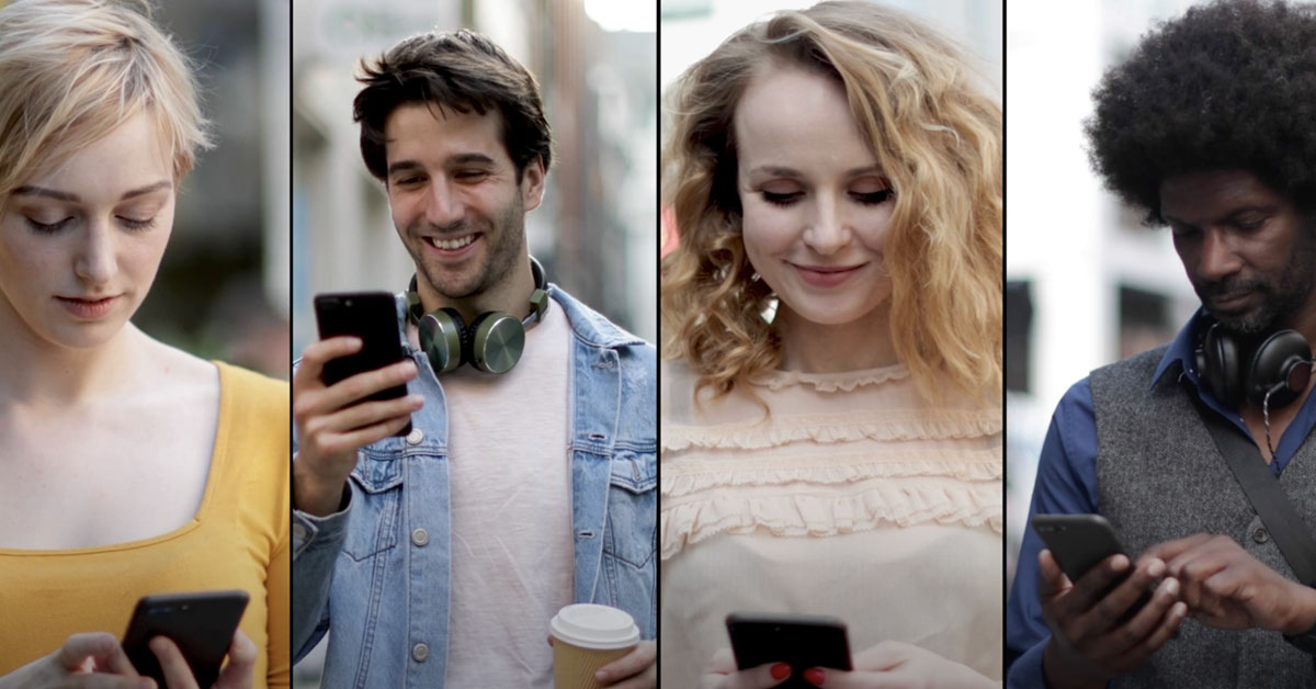 a group of people looking at their phones