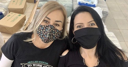 a couple of women wearing masks